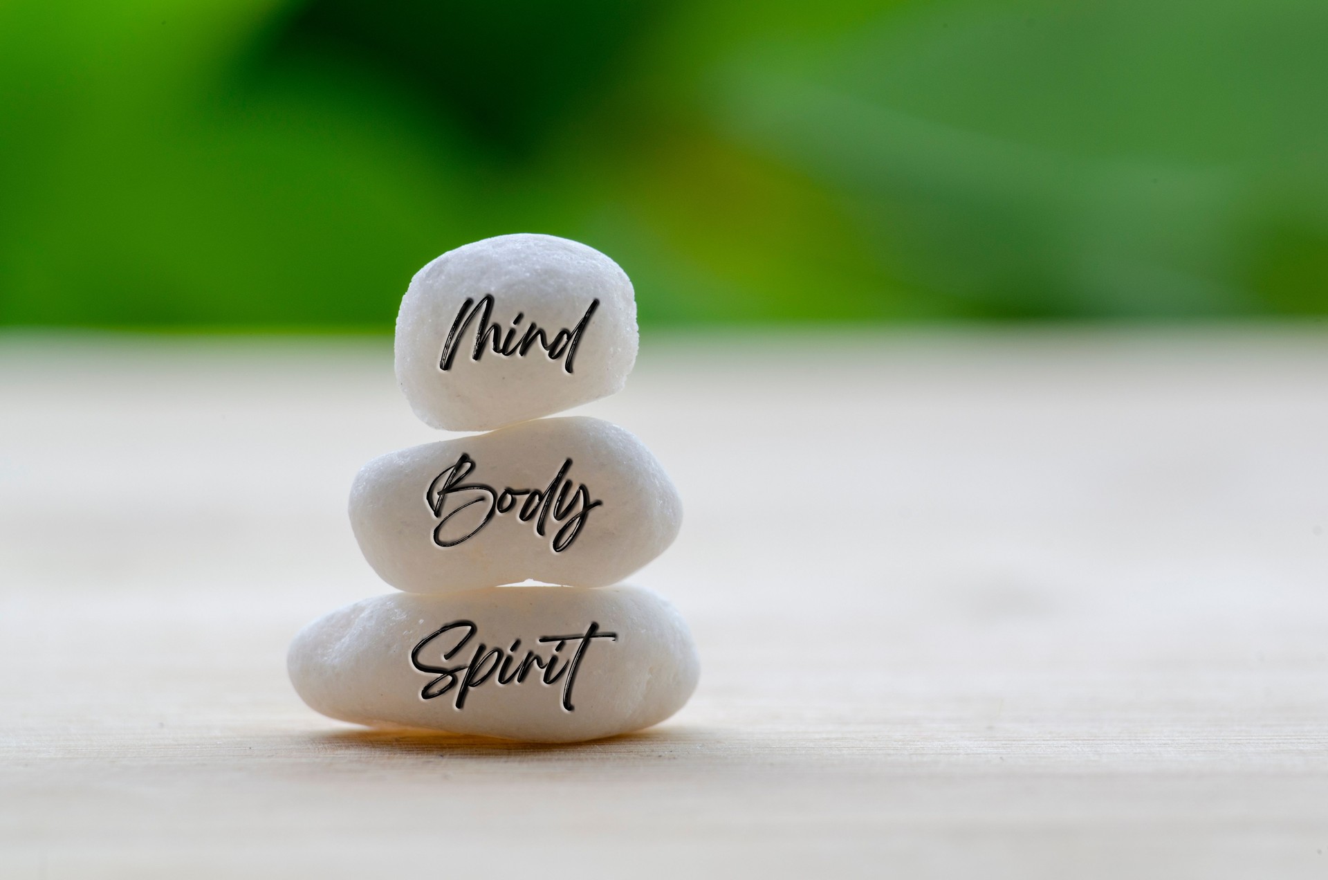 Mind, Body and Spirit text on the white Zen stones. Zen and peaceful concept